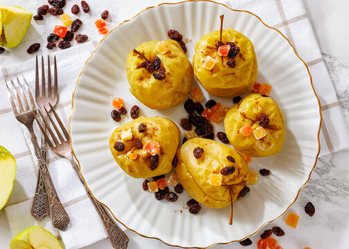 baked green apples with raisins, candied fruit