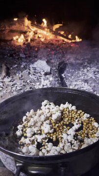Campfire Popcorn Prep: Sizzling Oil & Wood Fire