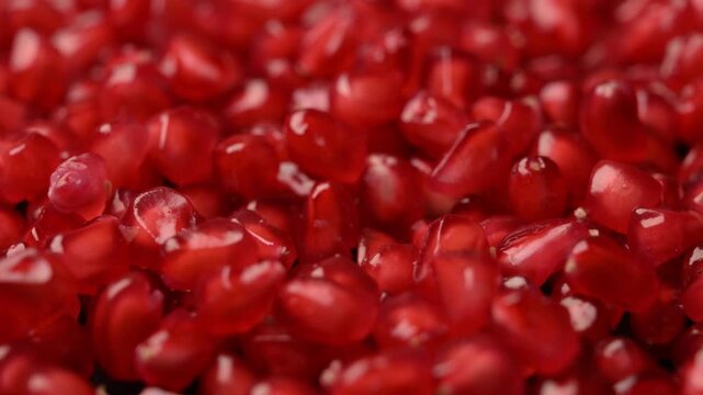 Slow Rotating Ruby Pomegranate Arils Captured from Angled Food Perspective