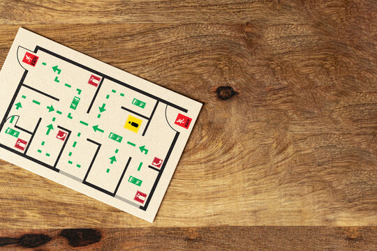 Emergency evacuation plan with clear exit routes and assembly points marked on a simple layout