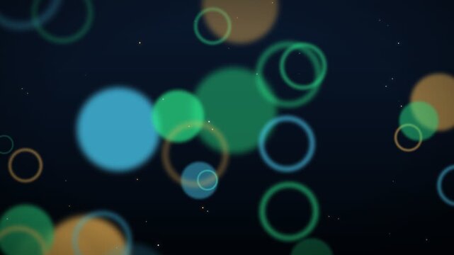 Abstract background with floating green blue and orange bokeh circles and sparkling particles on dark space loop