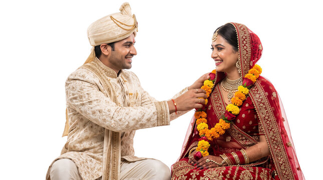 Traditional Indian wedding couple in ethnic attire, happy bride and groom during Varmala ceremony, cultural marriage celebration on white background