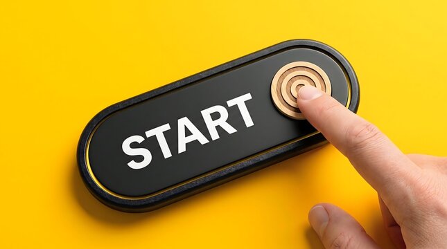 Finger pressing start button with target emblem on yellow background