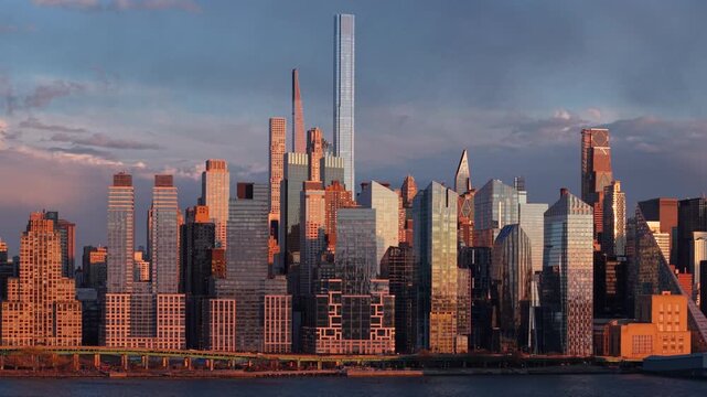 Aerial view of the Upper West Side and Midtown Manhattan skyline at sunset, with skyscrapers along the Hudson River and Riverside Park South, New York City, USA