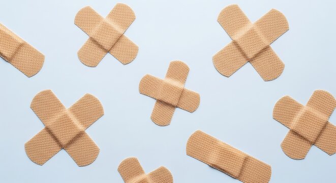 Band Aids on Light Blue Background.