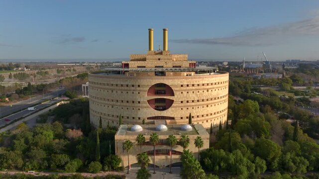  Torre Triana - Round Concrete Brutalist Building of Government Junta de Andalucia in Sevilla, Spain. Aerial Drone Shot.
