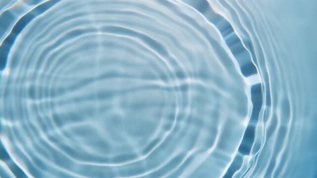 Transparent crystal surface generates circular expanding light ripples, overlapping optical waves forming mesmerizing interference patterns and soft caustic reflections with futuristic luxury atmosphe