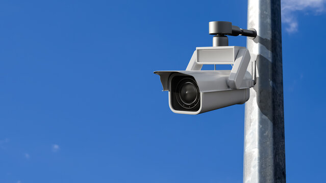 Security surveillance. Outdoor CCTV camera mounted on a pole monitors public areas, infrastructure and property with copy space for text.