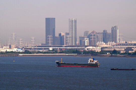 Cargo ship sails on the sea befor skyline