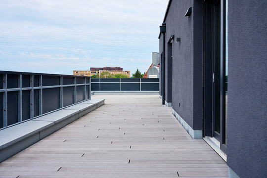 Empty apartment terrace with wooden decking
