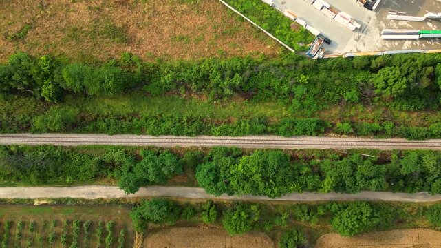 Top Down Aerial View of Railway Track Through Green Vegetation near Plovdiv, Bulgaria