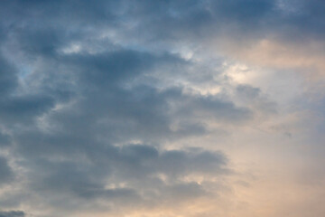 Obraz premium Dramatic Dark Clouds Illuminated By Warm Sunlight