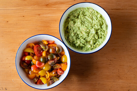 fresh tomatoes and avocado prepped in bowls