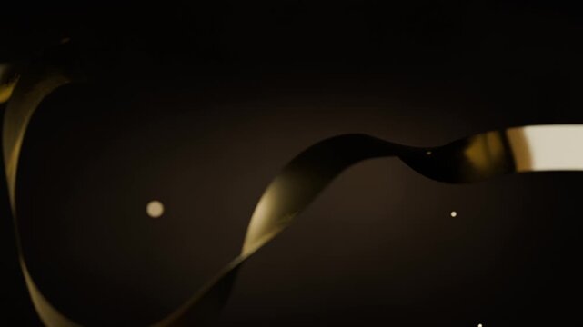 Sliding gold ribbon entering left, tilting and curling across dark gradient showing sheen with orbs