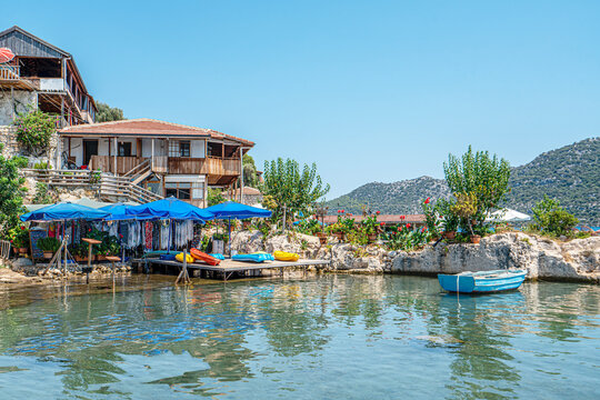 Turquoise waters and ancient Lycian coast of Kekova Island during a boat cruise in Antalya, Turkey.