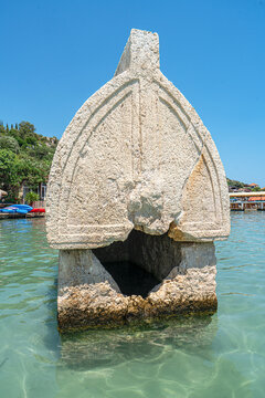 Turquoise waters and ancient Lycian coast of Kekova Island during a boat cruise in Antalya, Turkey.