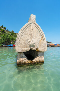 Turquoise waters and ancient Lycian coast of Kekova Island during a boat cruise in Antalya, Turkey.