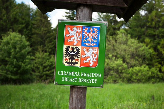 Beskids, Czech Republic, Czechia -  June 6, 2026: Signboard marking CHKO, Chranena krajinna oblast Beskydy (translation from Czech: Protected landscape area Beskids). Shallow focus.