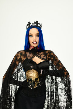 Gothic sorceress with blue hair embraces Halloween spirit in dark elegance