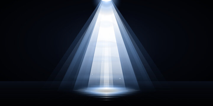 Bright Spotlight Beam Shining Down on a Dark Empty Stage Floor
