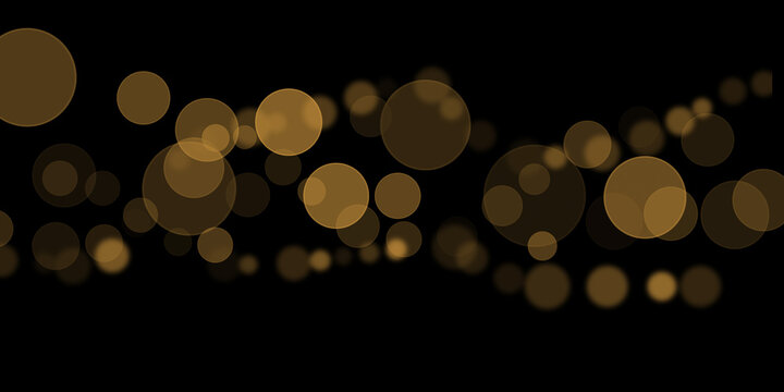 Golden bokeh light spheres float across a dark black background creating a festive glow
