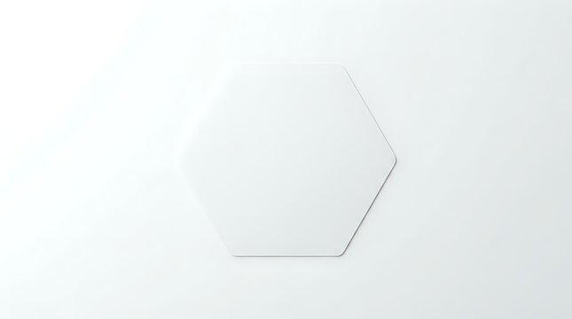 Minimalist geometric hexagon shape with subtle shadow on neutral light gray background for modern design projects.