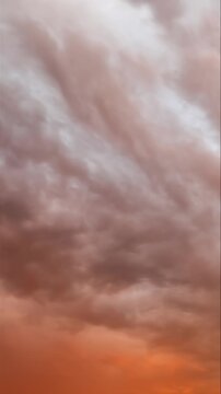Vertical timelapse of dramatic undulatus asperitas storm clouds at sunset