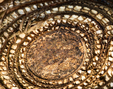 Circular pattern of woven, aged, textured material