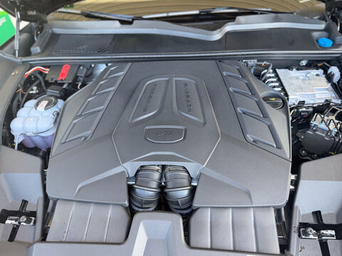 Close up of a modern car engine bay with a v8 engine cover and visible components under the hood porsche cayenne gts Poland, Pszczyna, 3.08.2026 
