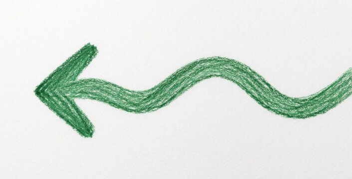 Green wavy arrow drawn with crayon points left on white paper. Simple handmade graphic symbol indicates direction, movement, or a path. Design element with texture.