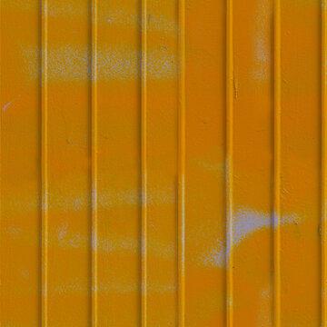 Seamless texture of a bright yellow corrugated metal wall with faint spray paint marks. Industrial ribbed steel background with copy space