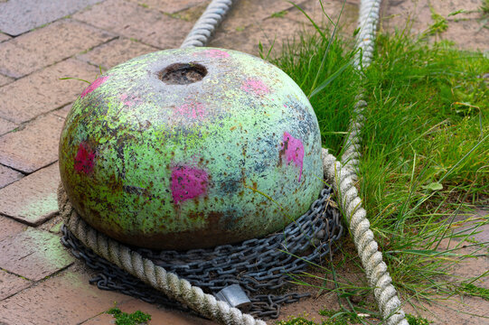 Weathered Harbor Mooring Buoy with Rope and Chain