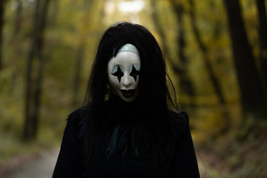 Spooky and scary Halloween themed image in a dark forest. 