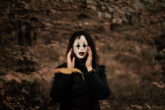 Spooky and scary Halloween themed image in a dark forest. 