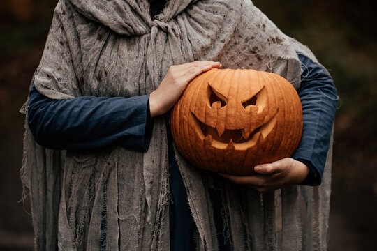 Spooky and scary Halloween themed image in a dark forest. 