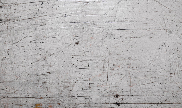 Dark grunge texture on old weathered white painted wooden planks