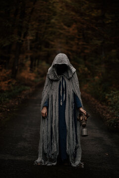 Spooky and scary Halloween themed image in a dark forest. 