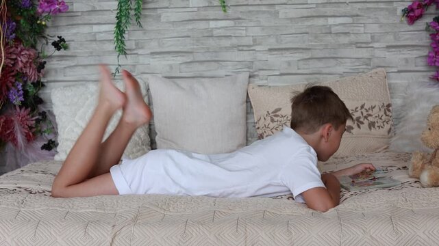 Cute preschool child, boy, playing with toys in a sunny living room