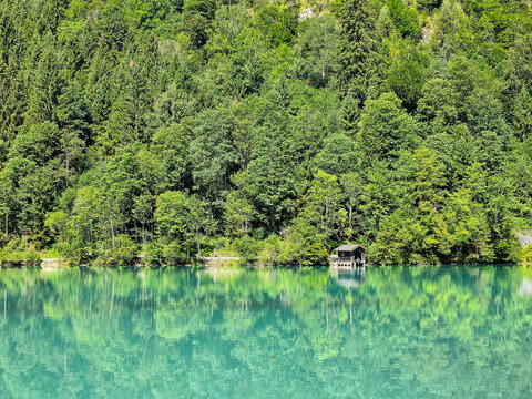 Boat house at lake in the forest, klammsee, kaprun, austria