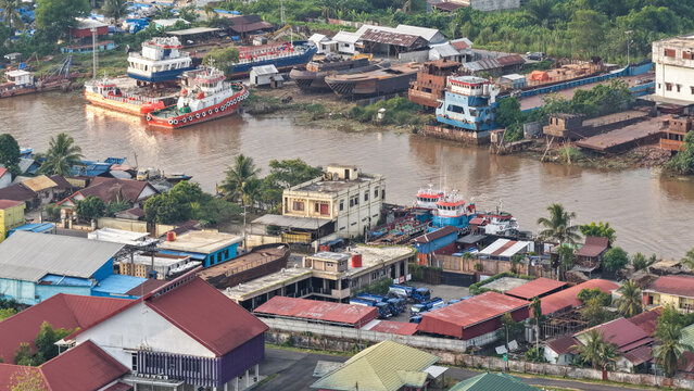 A view of Banjarmasin city and the Alalak River Bridge (or Basit Handil Bakti Bridge) in the late afternoon