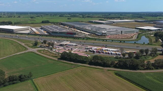 Aerial view of dutch highway a28 and industrial logistics park near zwolle