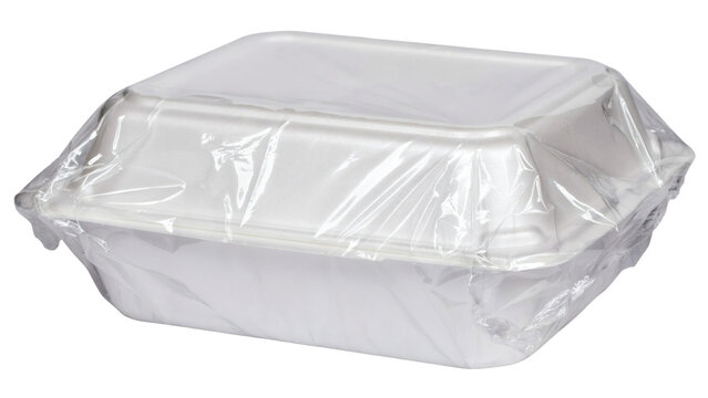 A white styrofoam takeout container with a lid on transparent background