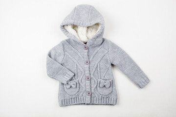 Cozy Grey Knitted Children Hooded Cardigan With Pockets. Warm Infant Winter Jacket on White Background. © dechevm