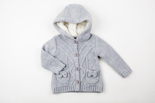 Cozy Grey Knitted Children Hooded Cardigan With Pockets. Warm Infant Winter Jacket on White Background.
