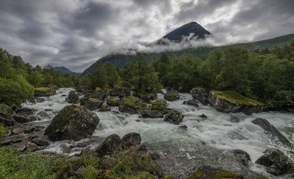 Torrential mountain stream, low-hanging clouds, Valld&oslash;la, Valldal, Norway