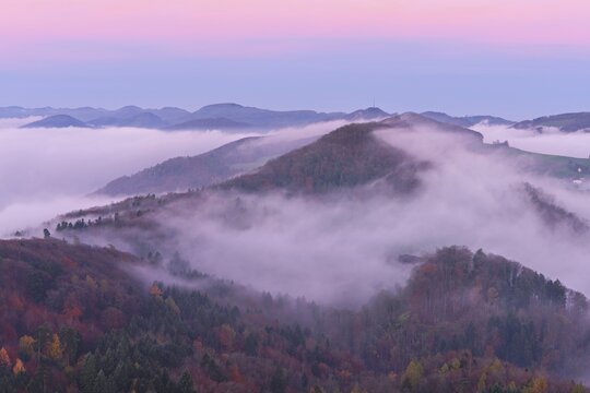 View from the Gisliflue of the Jurassic foothills covered in fog with the water fluh in the light of dawn, Talheim, Canton, Aargau, Switzerland