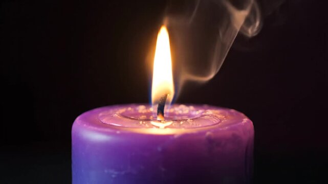 Burning purple candle with smoke on black background