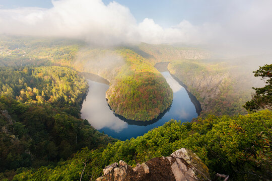 Scenic landscape view of famous horseshoe bend of Vltava river canyon from Maj viewpoint during golden sunset evening. Czech Republic nature travel destination and canyon valley panorama concept.