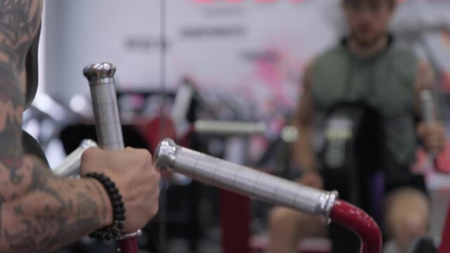 Workout session at fitness gym with intense focus on strength training and exercise routines