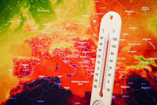 Thermometer showing extreme high temperature on a red European weather heat map background, symbolizing global warming, climate crisis, and severe summer heatwave in Europe.
